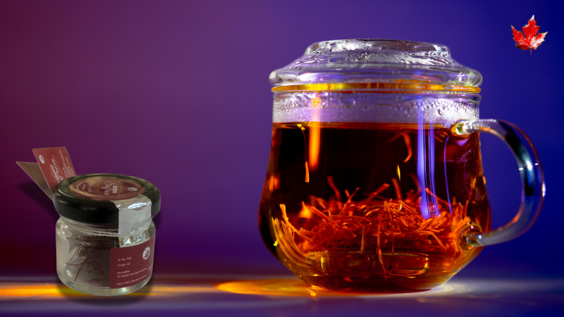 A glass mug filled with premium Kashmiri saffron strands against a vibrant purple background.